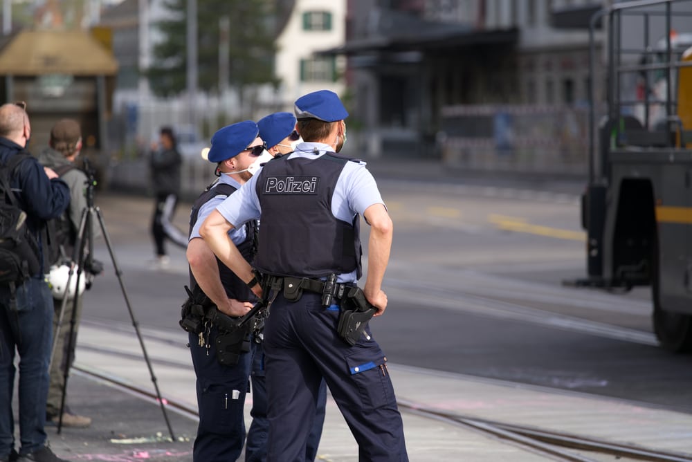 The police in front of and behind the lens